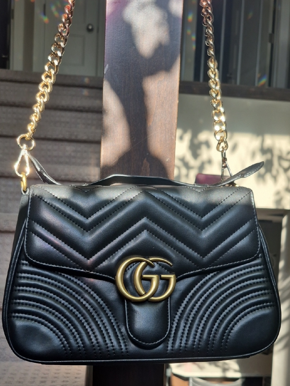 Black Quilted Shoulder Bag with Gold Hardware